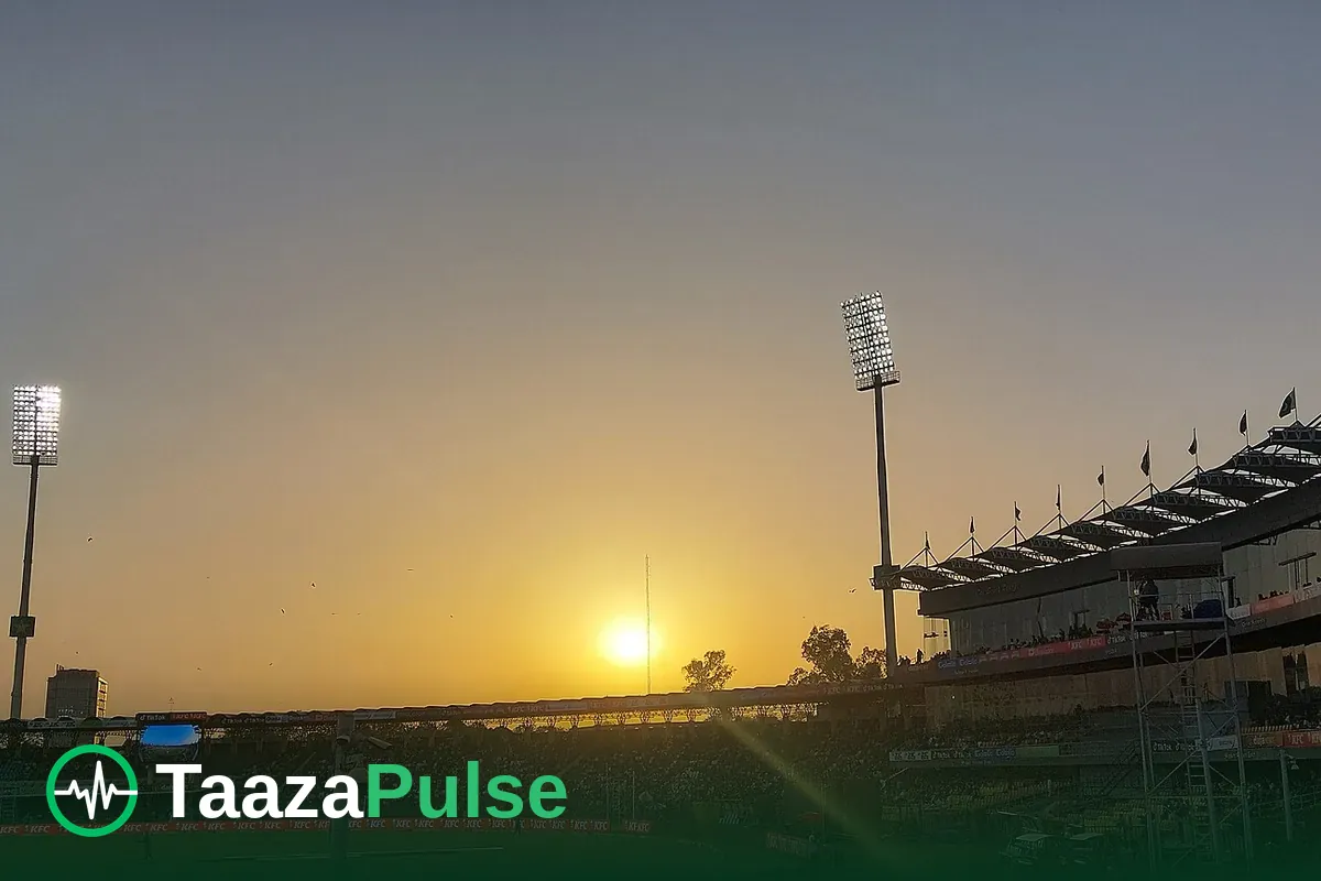 Gaddafi Stadium under floodlights at sunset in Lahore