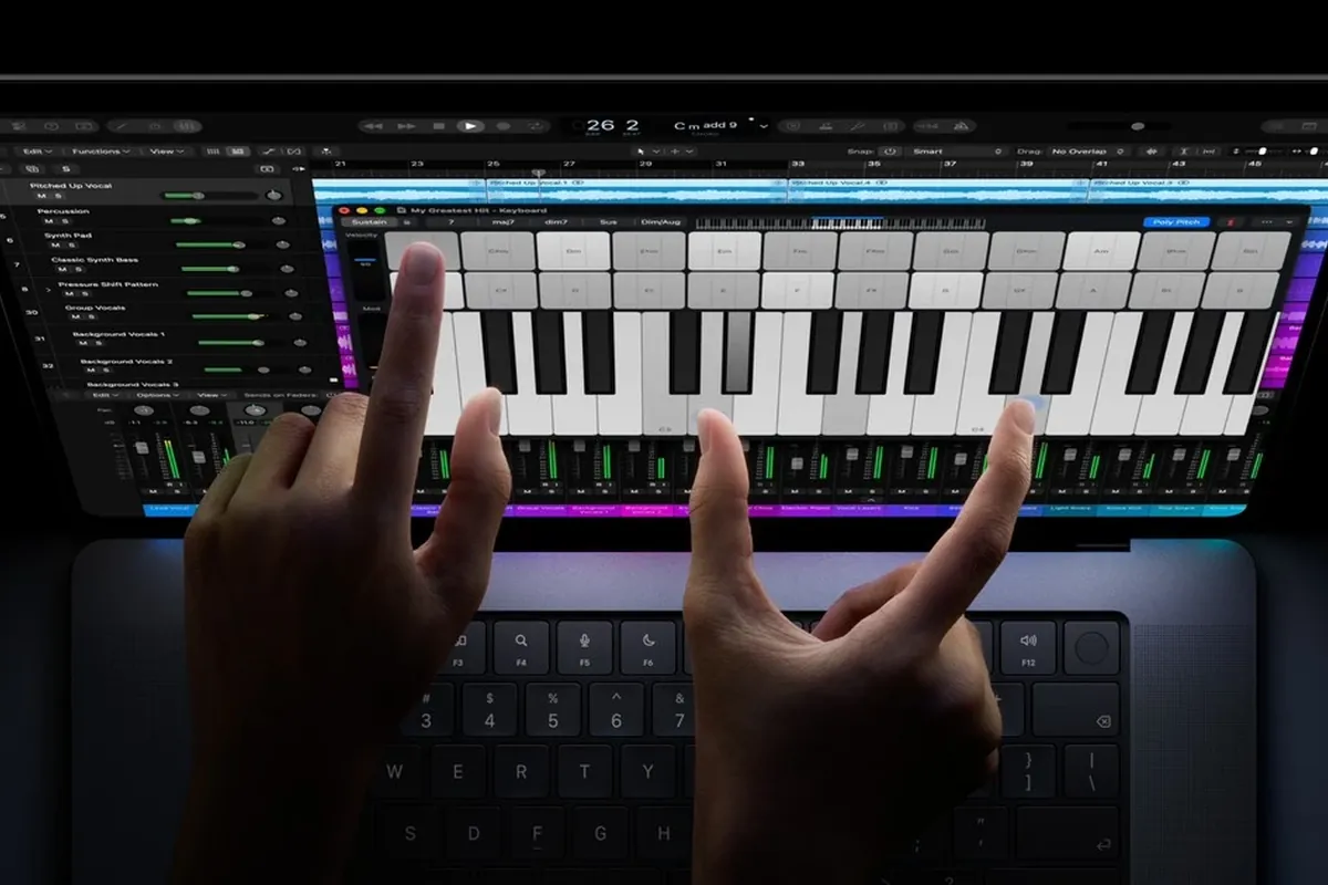 MacBook Pro keyboard and trackpad with touch display above