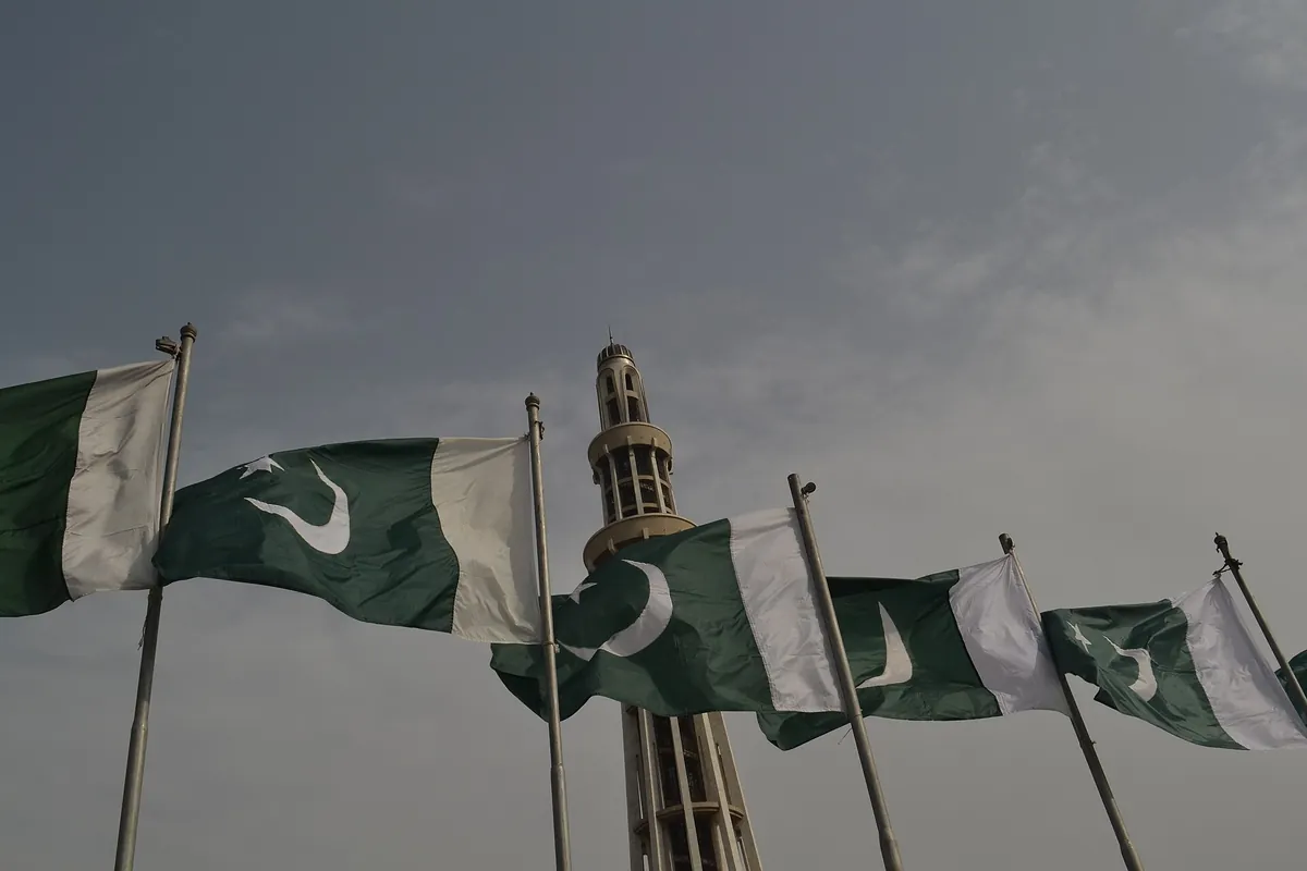Pakistani flags waving in front of the Minar-e-Pakistan tower in Lahore