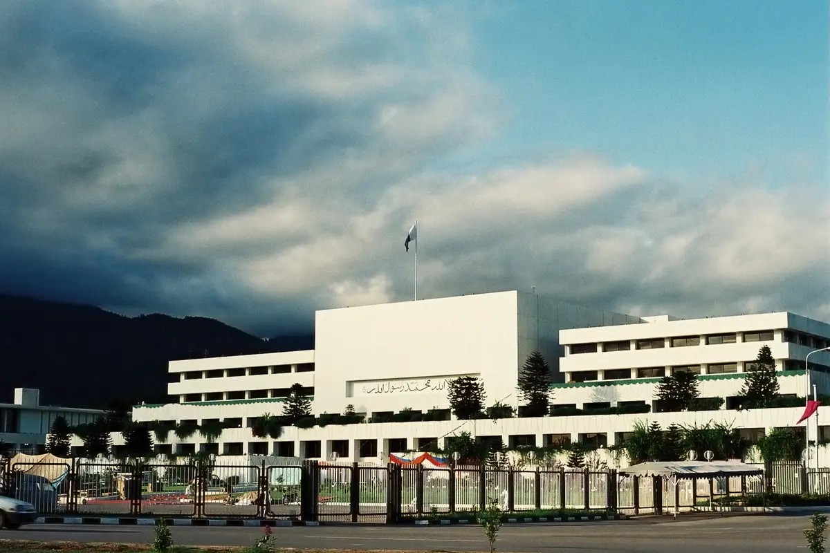 Parliament House in Islamabad under a cloudy sky