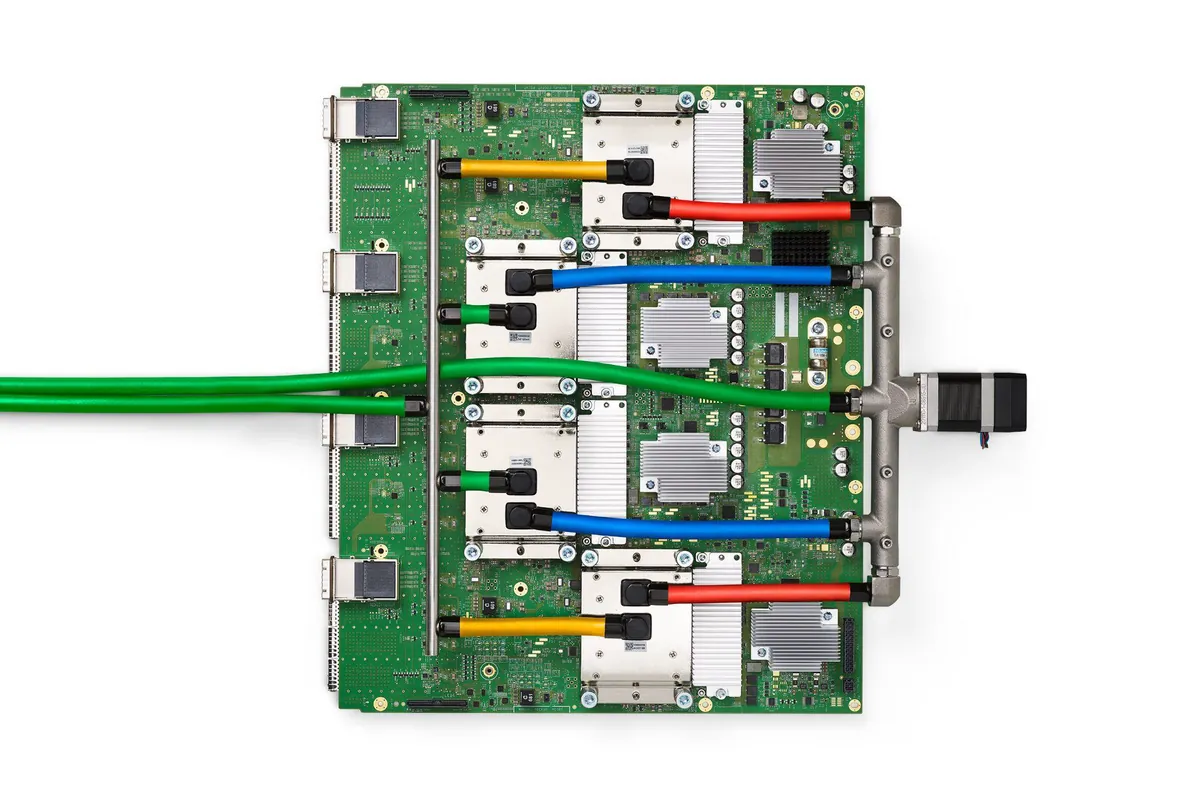A Google TPU AI accelerator board with cooling cables