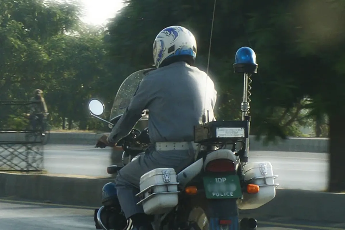Islamabad police officer riding a motorcycle