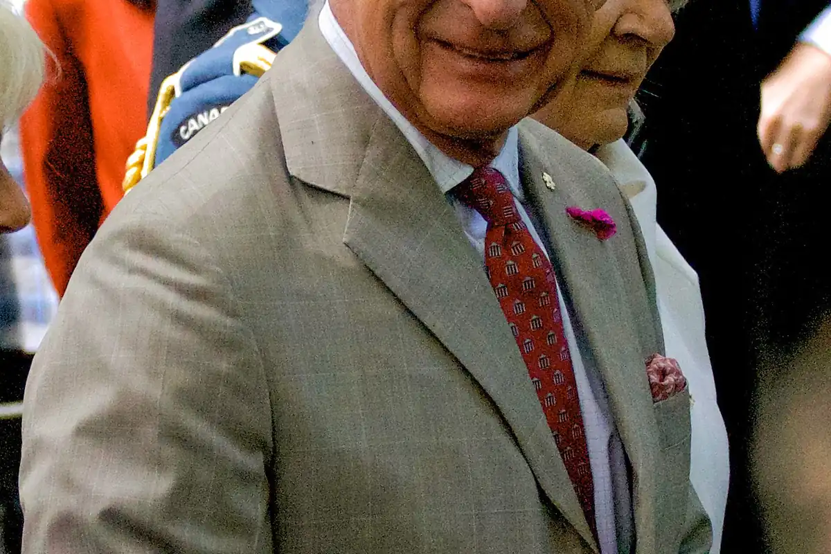 King Charles III smiling during a public engagement