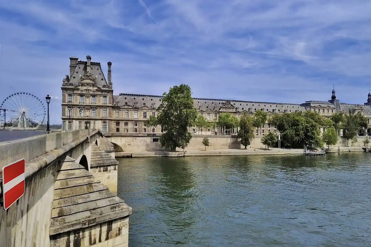 The Louvre palace seen from across the River Seine in Paris