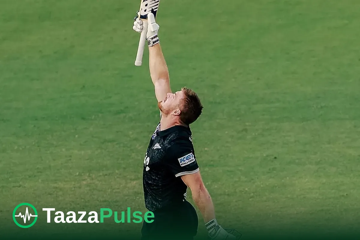 Glenn Phillips raises his bat after reaching a century for New Zealand