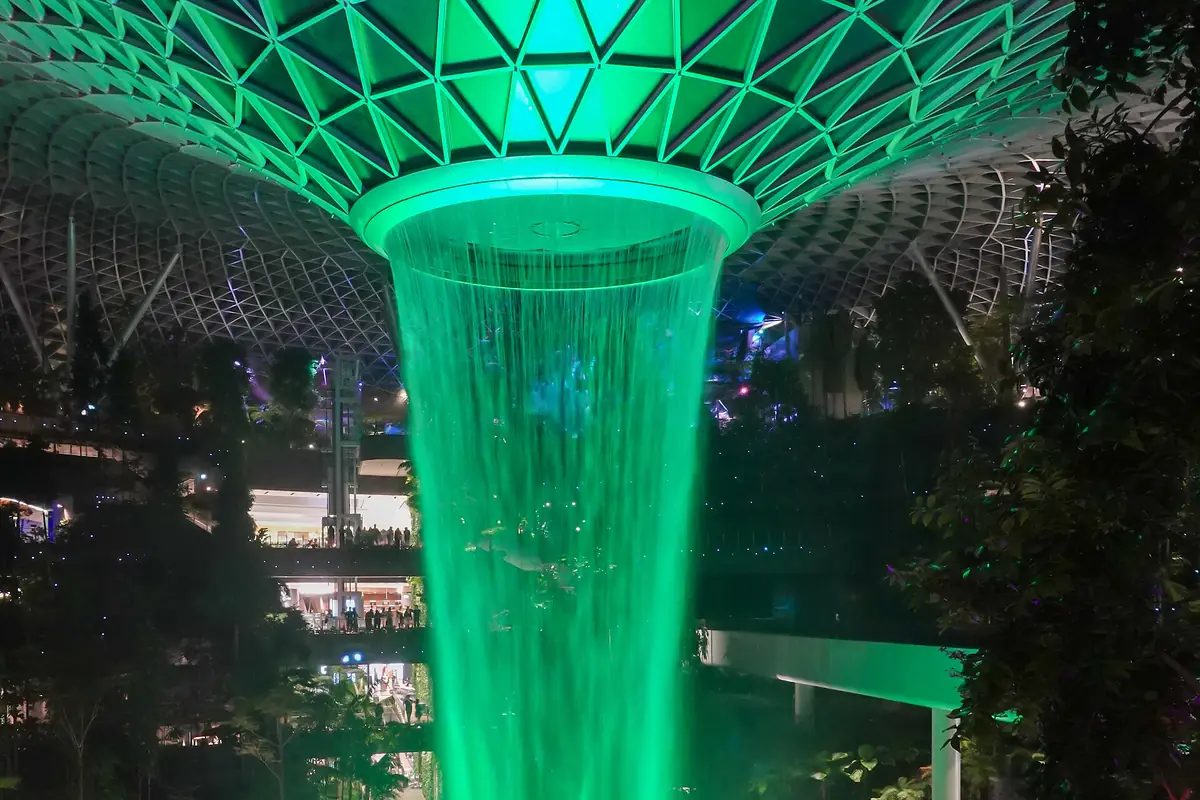The Rain Vortex waterfall at Jewel Changi Airport, Singapore, at night