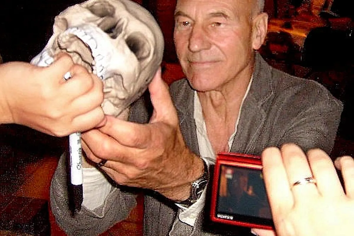 Patrick Stewart signing autographs for fans