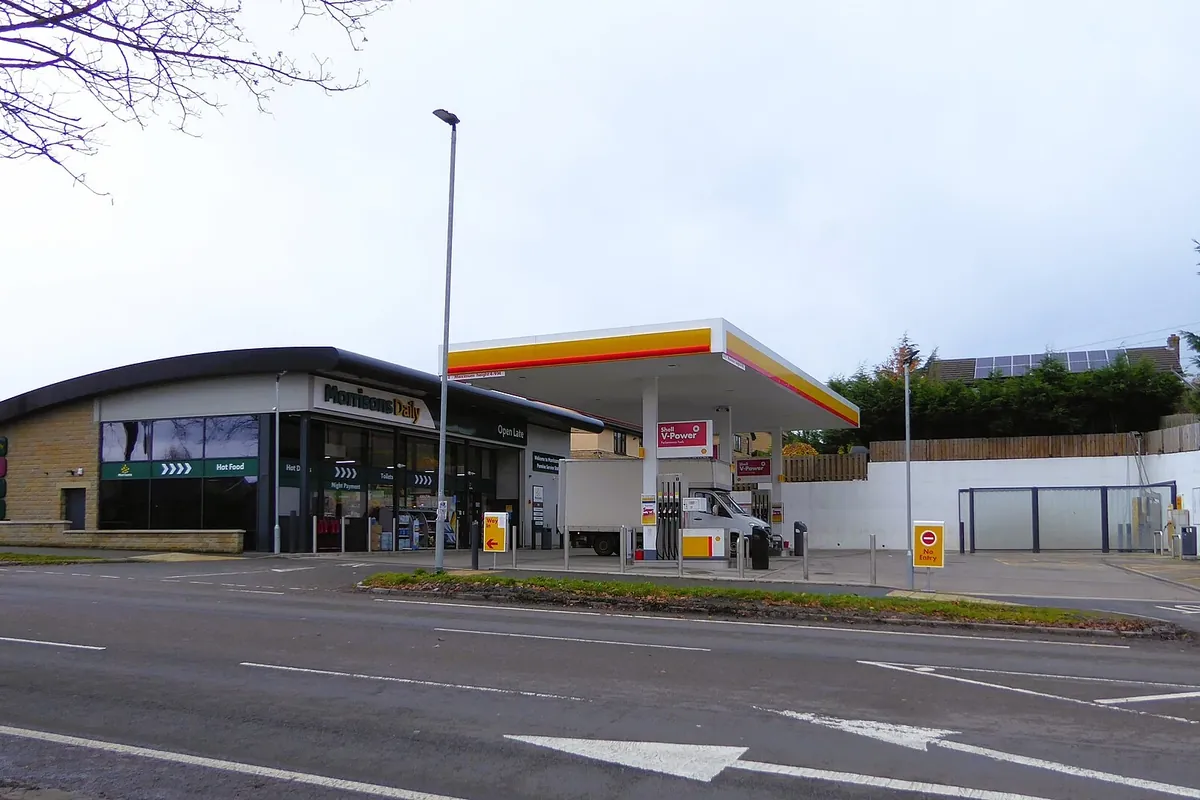 A Shell forecourt with a convenience store
